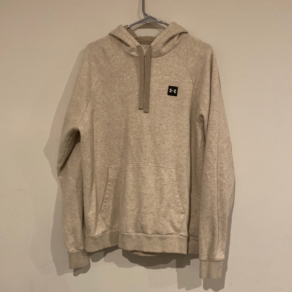 Cream colored Under Armour hoodie.